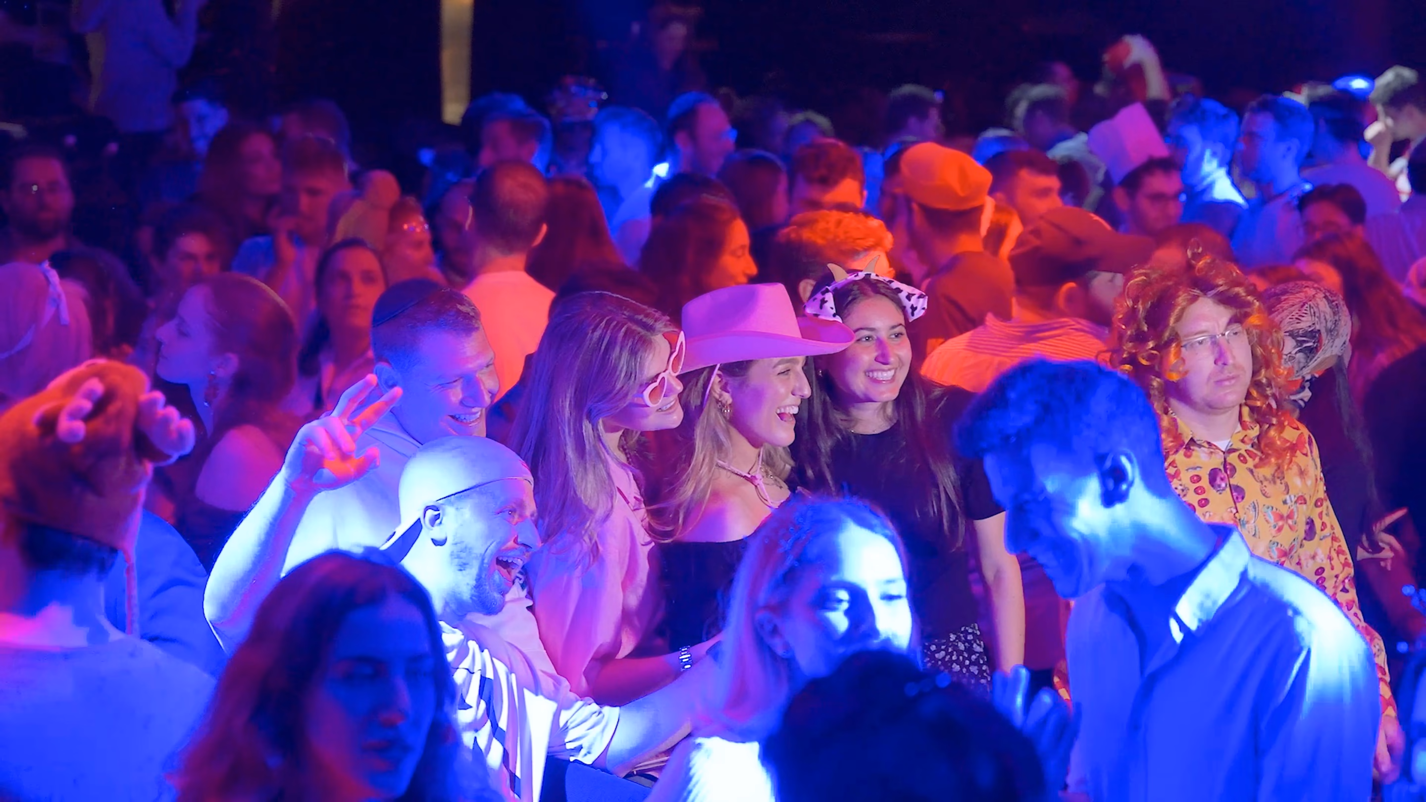 Dance floor under the lights from the Purim party aftermovie